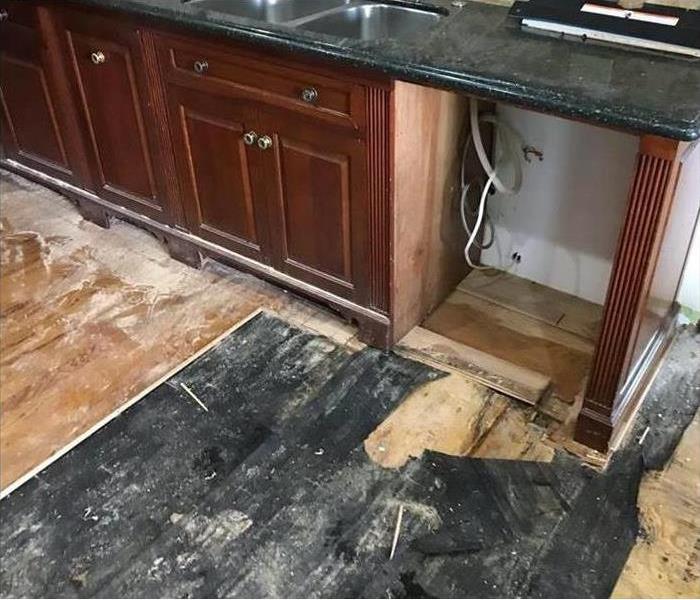 Demo of water damage flooring