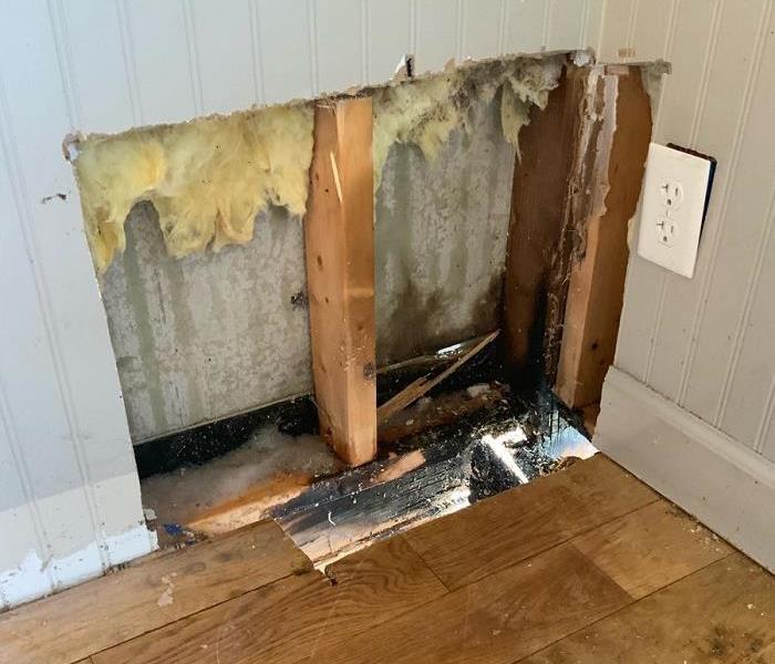 Wall damage from fire/water.